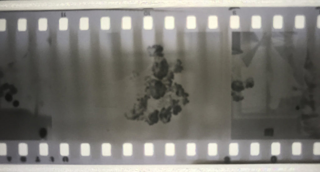 A negative with streaks coming from the sprocket holes.