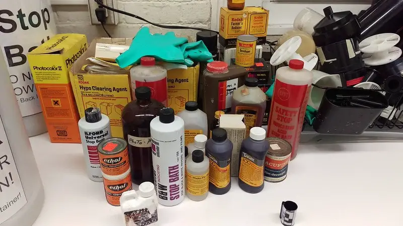 Some darkroom chemicals and developing tanks. 
