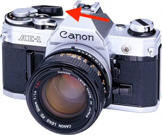 The film advance lever on a Canon AE-1 35mm Film Camera