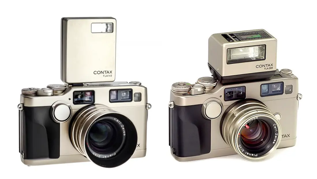 The Contax TLA140 flash (left) and Contax TLA 200 (right) on Contax G2 35mm film cameras. 