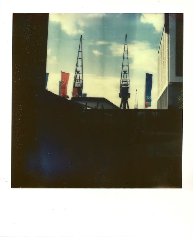 Instant Film with X-Ray Fog. Notice the white and dark strips at the top the image. 
