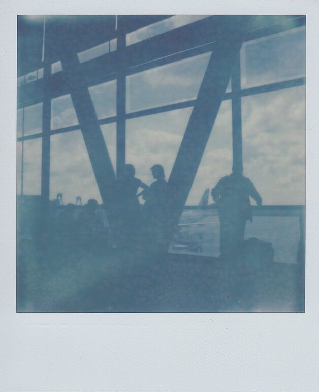 Instant Film with X-Ray Fog. Notice the random white marks and overall low contrast.