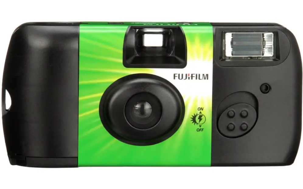 The Front of a Fujifilm disposable or single-use camera. Note the slide button to turn on and off and to charge the camera flash.
