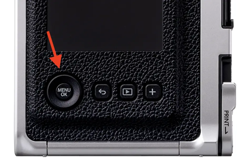 The back of the Instax Mini Evo. To activate the self-timer you need to turn on the camera and use the menu button. 