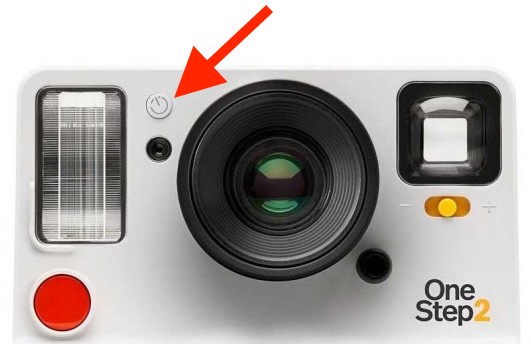 The self-timer button located on the front of the Polaroid OneStep2 between the lens and the flash.