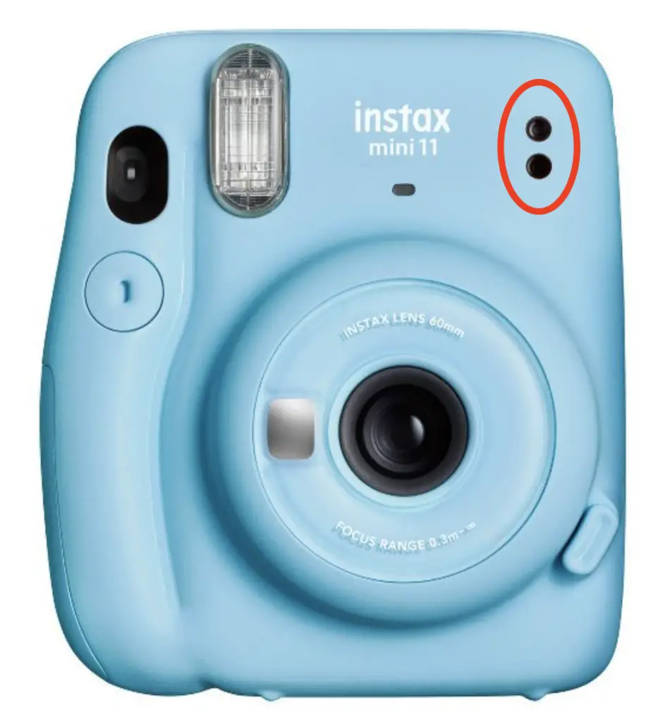 The two small holes on the Instax Mini 11 that calculates exposure