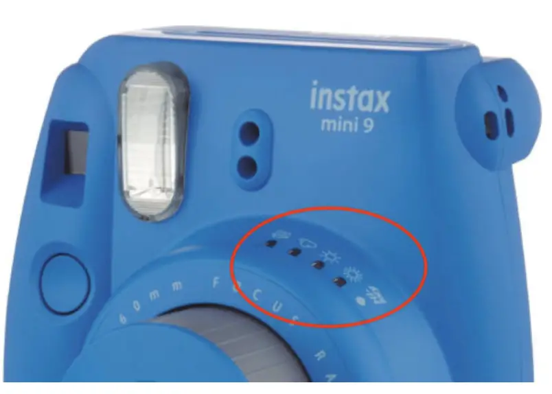 The brightness indicator lights on the front of the camera will all blink orange if the batteries in the camera are low or if there is something else wrong (like a paper jam (with the camera)